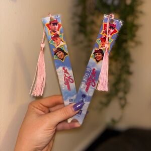 A League of Their Own VHS tape bookmark’s featuring pink tassels.